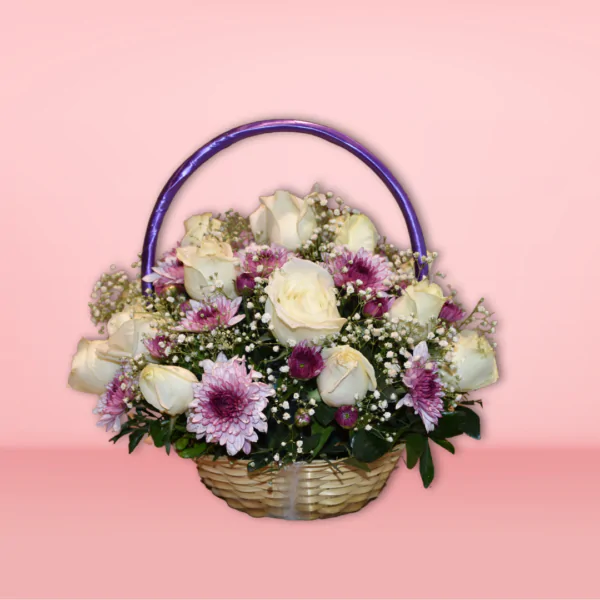 Flower basket made with white roses, chrys, and baby's breath