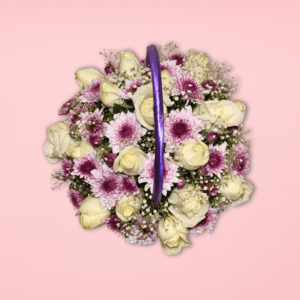 Flower basket made with white roses, chrys, and baby's breath