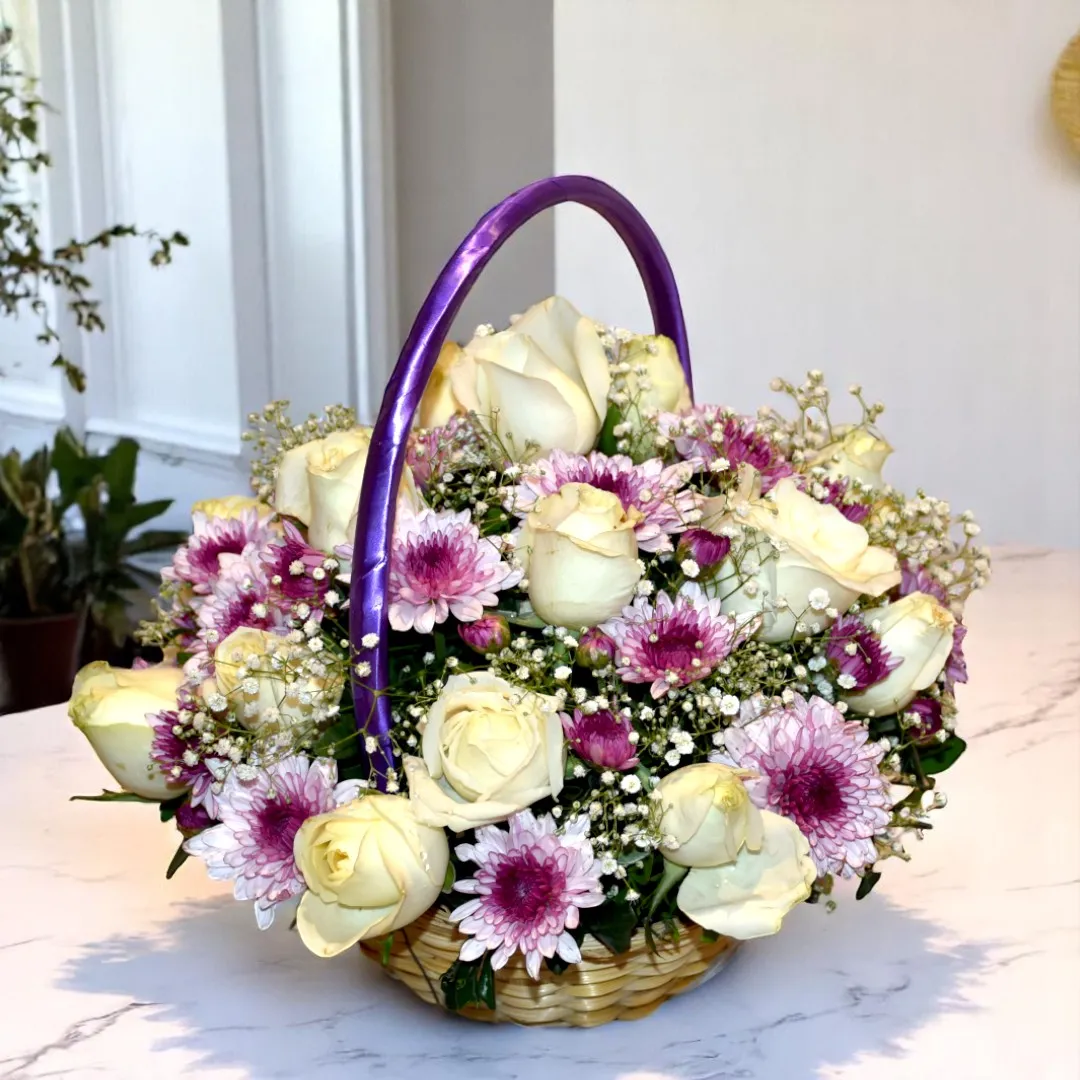Buy Beautiful flower basket of white roses & purple chrysanthemum at best prices online in Hyderabad, Mumbai, Delhi, Bangalore, and Chennai