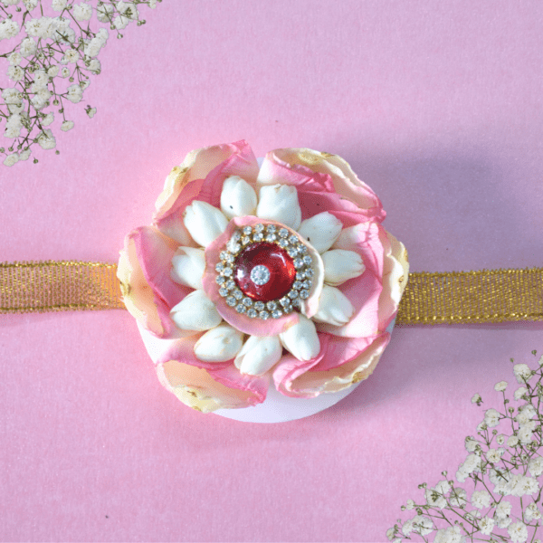 Beautiful traditional Indian flower rakhi skillfully made with rose petals and jasmine flowers