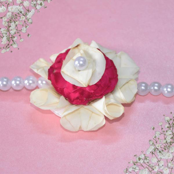 Floral rakhi with white rose petals and pink roses