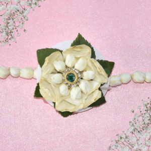 Eco-friendly white floral Rakhi handcrafted with fresh flowers and a central gem