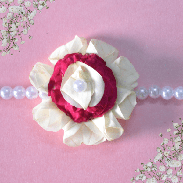 Floral rakhi with white rose petals and pink roses