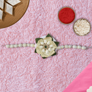 Eco-friendly white floral Rakhi handcrafted with fresh flowers and a central gem