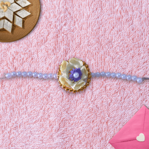 Floral Rakhi with White Rose, Gypsy, Pearls & Golden Beads