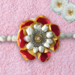 Red & Yellow rose Rakhi adorned with Arabian Jasmine bracelect