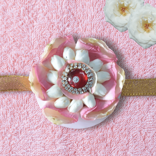 Beautiful traditional Indian flower rakhi skillfully made with rose petals and jasmine flowers