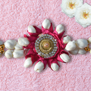 stunning rose petals & Arabian jasmine centerpiece adorned with glistening rhinestones