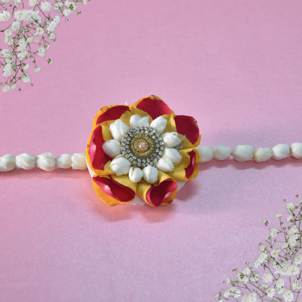 Red & Yellow rose Rakhi adorned with Arabian Jasmine bracelect