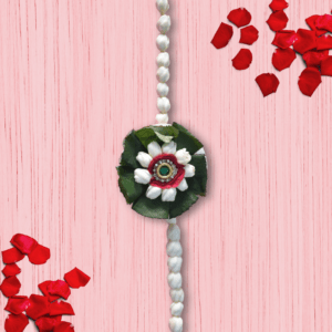 Eco-friendly floral rakhi with white jasmine buds, red rose center, green leaves, and jeweled centerpiece