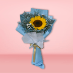 A beautiful bouquet featuring a large, vibrant sunflower surrounded by delicate baby's breath and greenery, wrapped in soft blue paper and tied with a shimmering gold ribbon.