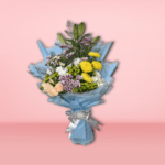 Mixed flower bouquet with yellow chrysanthemums, peach roses, white and purple carnations, wrapped in blue paper on a pink background.