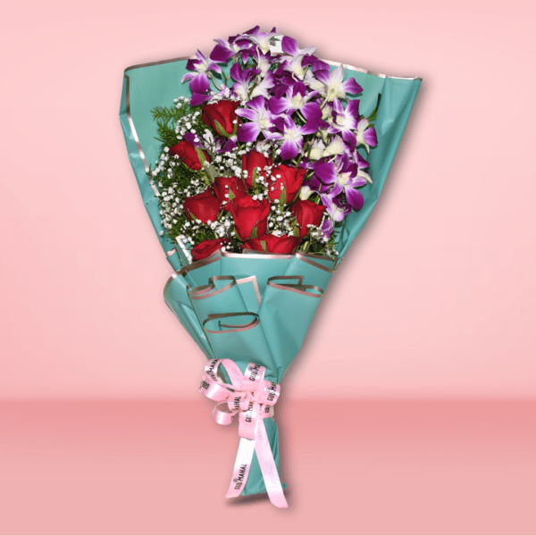 Mixed flower bouquet with red roses and purple orchids in teal wrapping