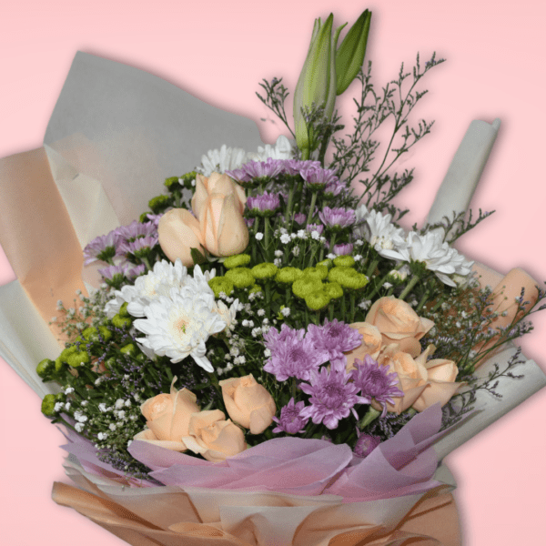 A beautiful bouquet featuring a variety of vibrant flowers, including roses, chrysanthemums, and baby's breath, wrapped in soft pastel paper and tied with a pink ribbon.