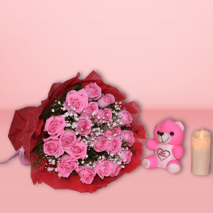 A bouquet of fresh pink roses surrounded by baby's breath and wrapped in red paper, perfect for special occasions.