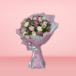 Elegant bouquet of pink, purple, and white roses wrapped in soft pink paper with a silver ribbon, perfect for special occasions.