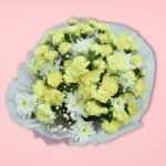 Vibrant yellow flower bouquet with carnations and baby's breath, wrapped in white and pastel paper, on pink background