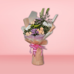 A beautiful bouquet featuring a variety of vibrant flowers, including roses, chrysanthemums, and baby's breath, wrapped in soft pastel paper and tied with a pink ribbon.