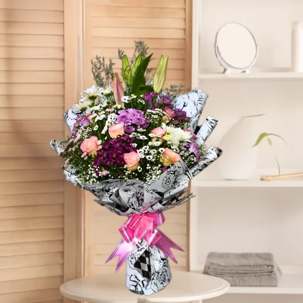 bouquet featuring roses, lilies, and chrysanthemums