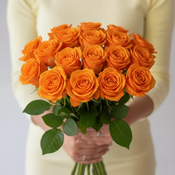 Orange Roses held in hands
