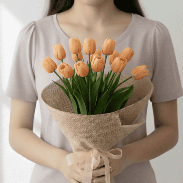 Peach Tulip Flowers held in hands