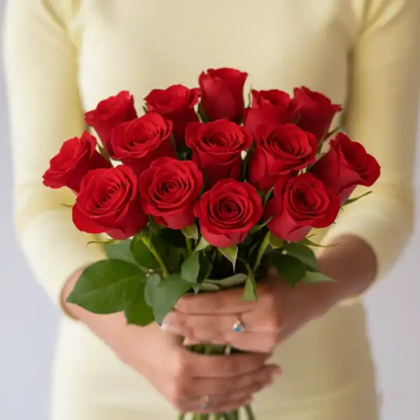 Red Roses held in a hand