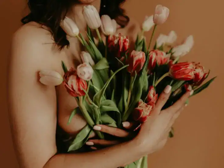 A girl holding flowers in her hand