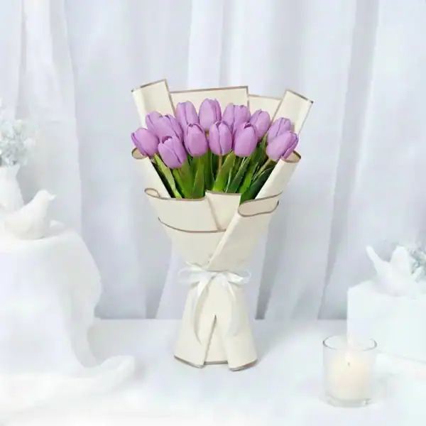Purple tulip flowers bouquet wrapped beautifully