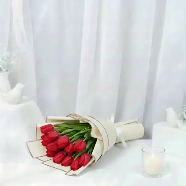 Red tulip flowers bouquet wrapped beautifully