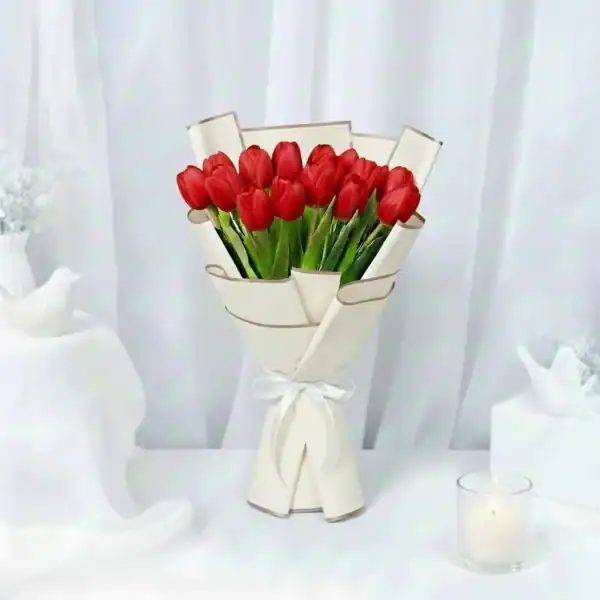 Red tulips bouquet wrapped beautifully by skilled craftsmen