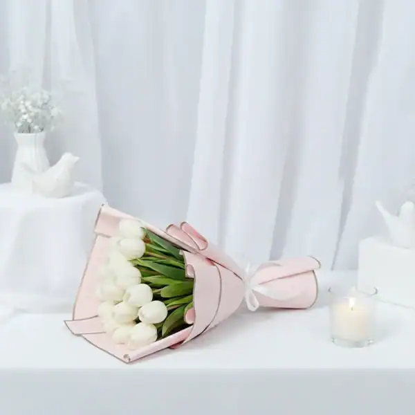 White tulip flowers bouquet wrapped beautifully
