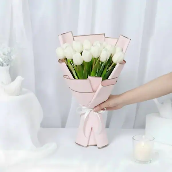 White tulip flowers bouquet wrapped beautifully in Korean Paper