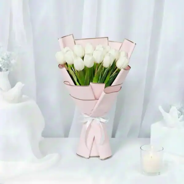 White tulips bouquet wrapped beautifully