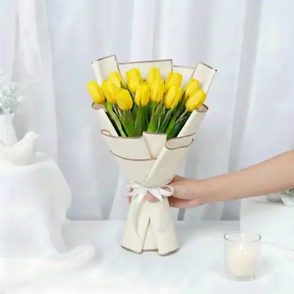 Yellow tulips bouquet wrapped beautifully