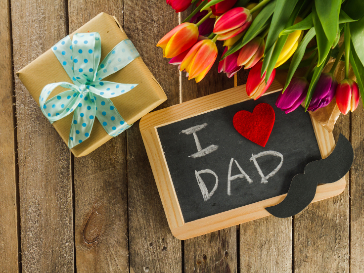 Father's Day Composition with beautiful tulip flower gift slate