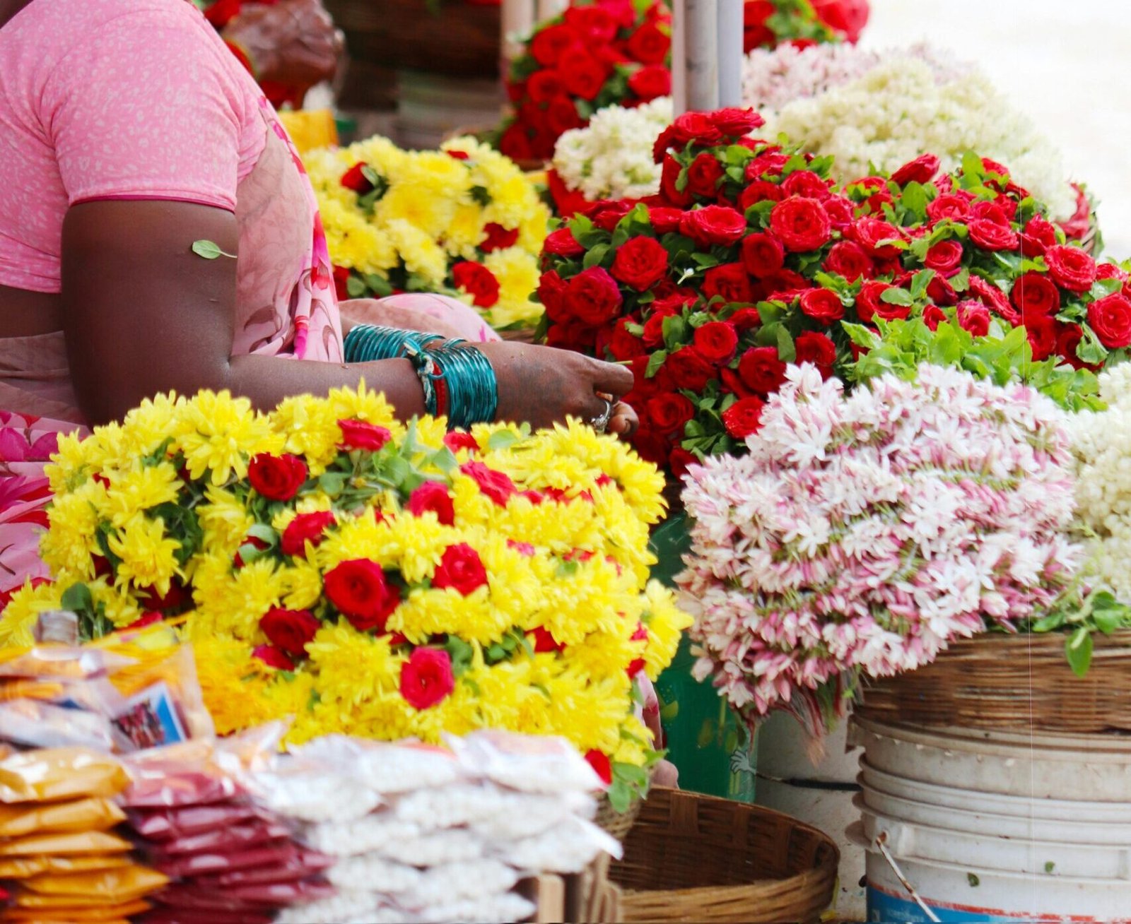 A woman selling flower in a flower market