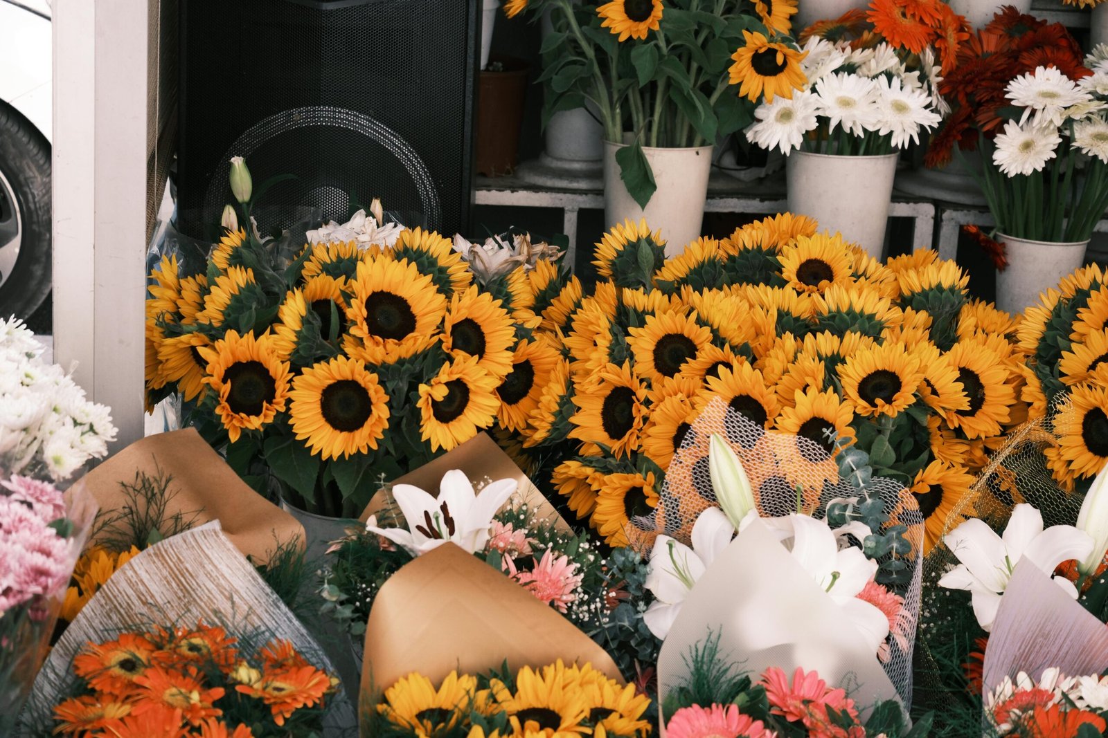 Beautiful sunflower, lilies and gerbera bouquets are displayed at a flower boutique