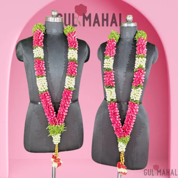 A pair of Elegant rose Bride and Groom wearing rose petals & jasmine garland & jasmine garland for bride and groom for wedding/reception/engagement
