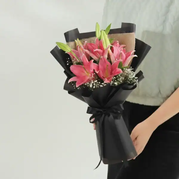 Beautiful Pink Lily Bouquet held in hands