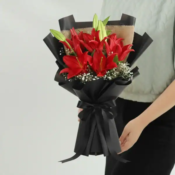 Beautiful Red Lily Bouquet held in hands