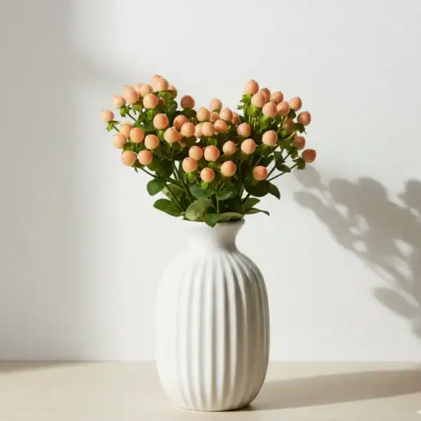 Peach Hyperciums Berry in a vase