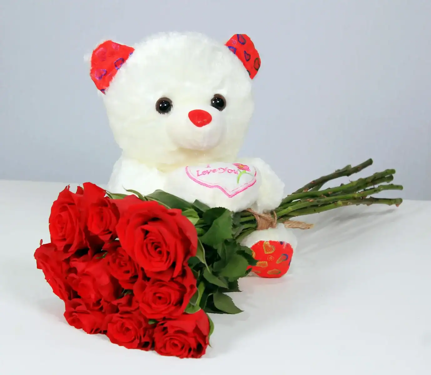 White teddy bear with red rose bouquet, perfect romantic gift