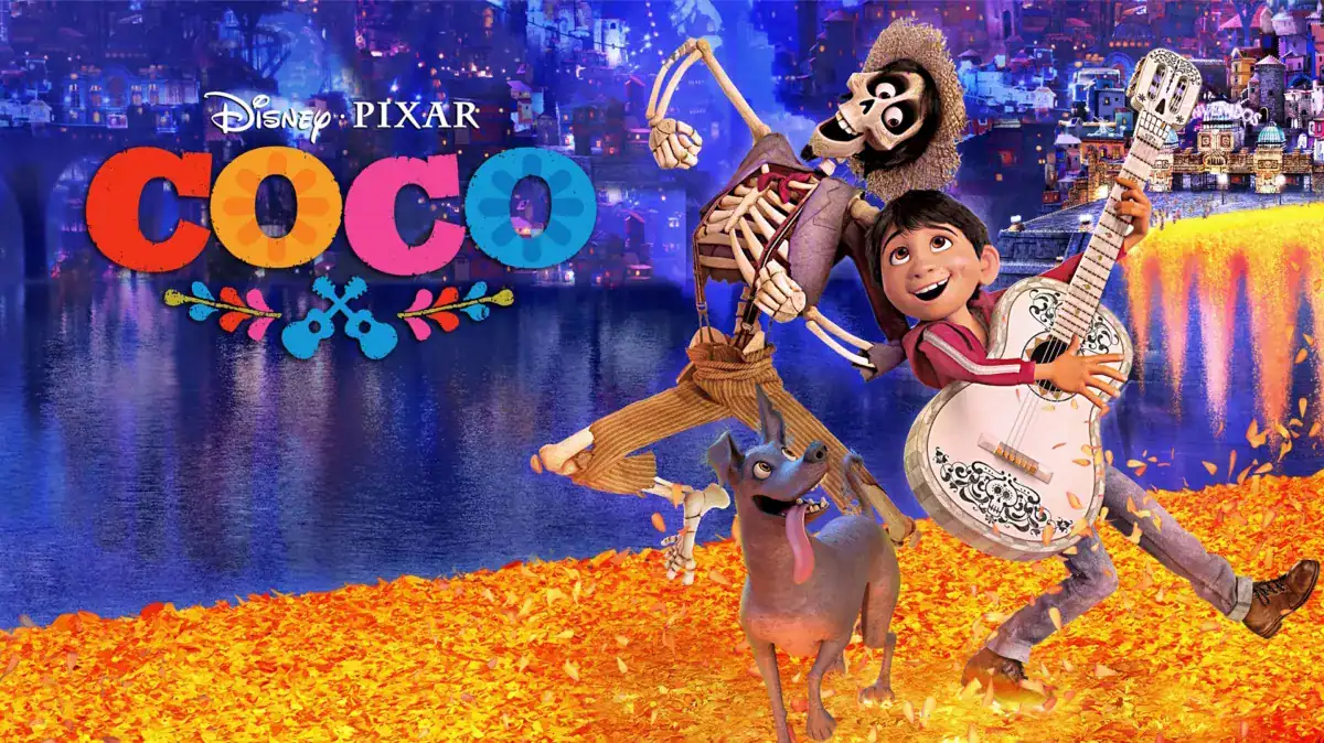 Official movie poster for Disney Pixar's "Coco" featuring Miguel with his white guitar, the skeleton Héctor, and Dante the dog running across a bridge of vibrant orange marigold petals against a glowing Land of the Dead background.