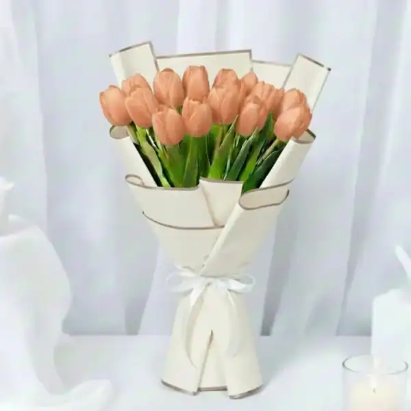 Peach tulip flowers bouquet wrapped in beautiful korean paper