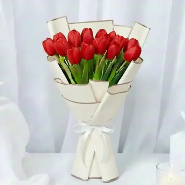 Red tulips bouquet wrapped beautifully by skilled craftsmen