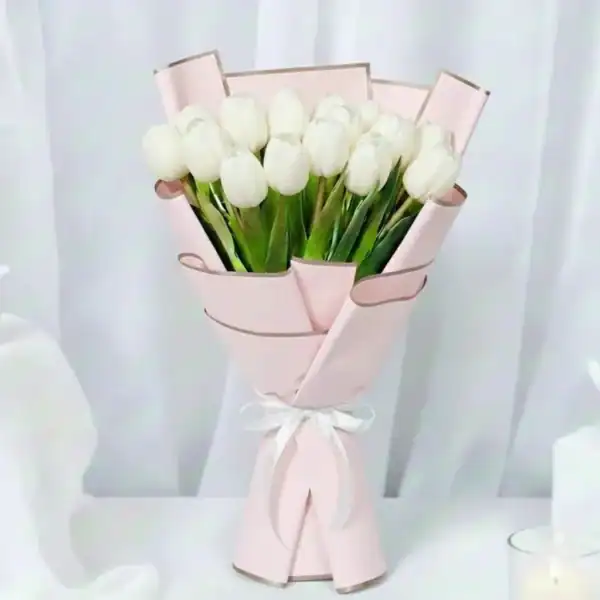 White tulips bouquet wrapped beautifully