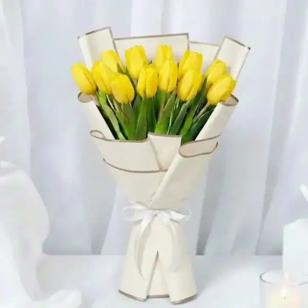 Yellow tulip flowers bouquet wrapped beautifully