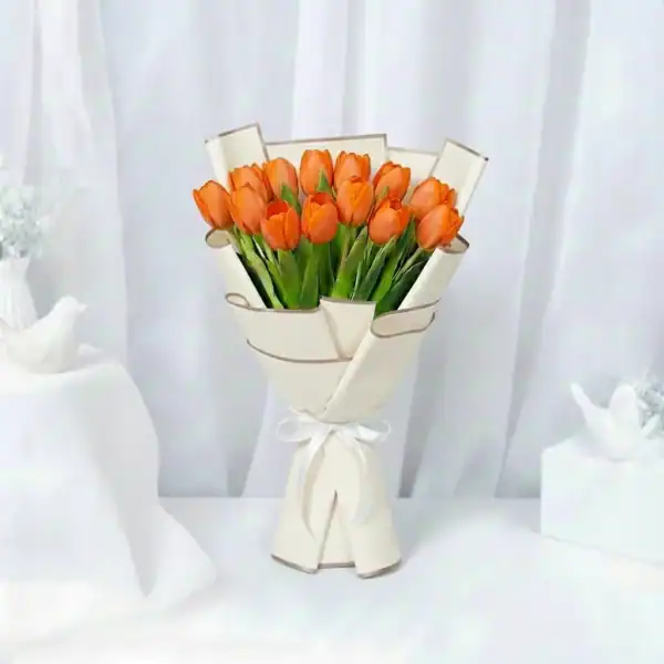 Orange tulips bouquet wrapped in beautiful korean paper