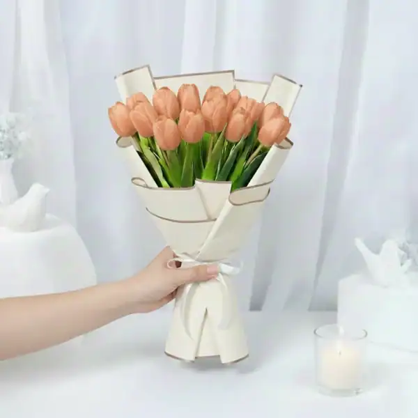Peach tulip flowers bouquet wrapped in beautiful korean paper