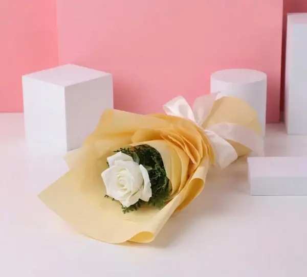 Single Stem White Rose Bouquet on table